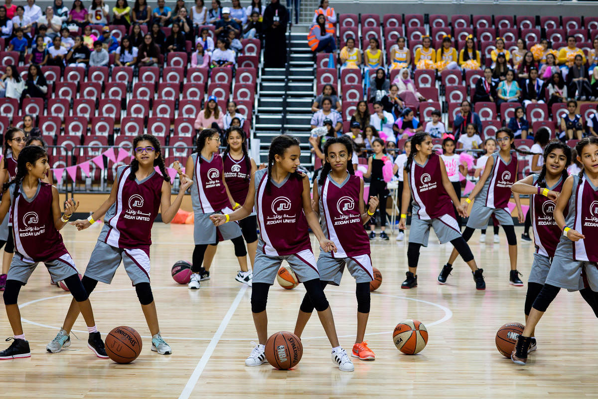 Young cheerleaders at an all-female basketball tournament to raise awareness for breast cancer, which men were barred from attending, in Jeddah, Saudi Arabia, Nov. 11, 2017. Iran and Saudi Arabia, the archrivals of the Middle East, are competing in a surprising new arena: which country is less repressive toward women. (Tasneem Alsultan/The New York Times)