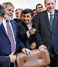 Brazilian President Luiz  Inacio Lula da Silva (left), Turkish Prime Minister Recep Tayyip Erdogan (right) and Iranian President Mahmoud Ahmadinejad in Tehran on Monday. AFP