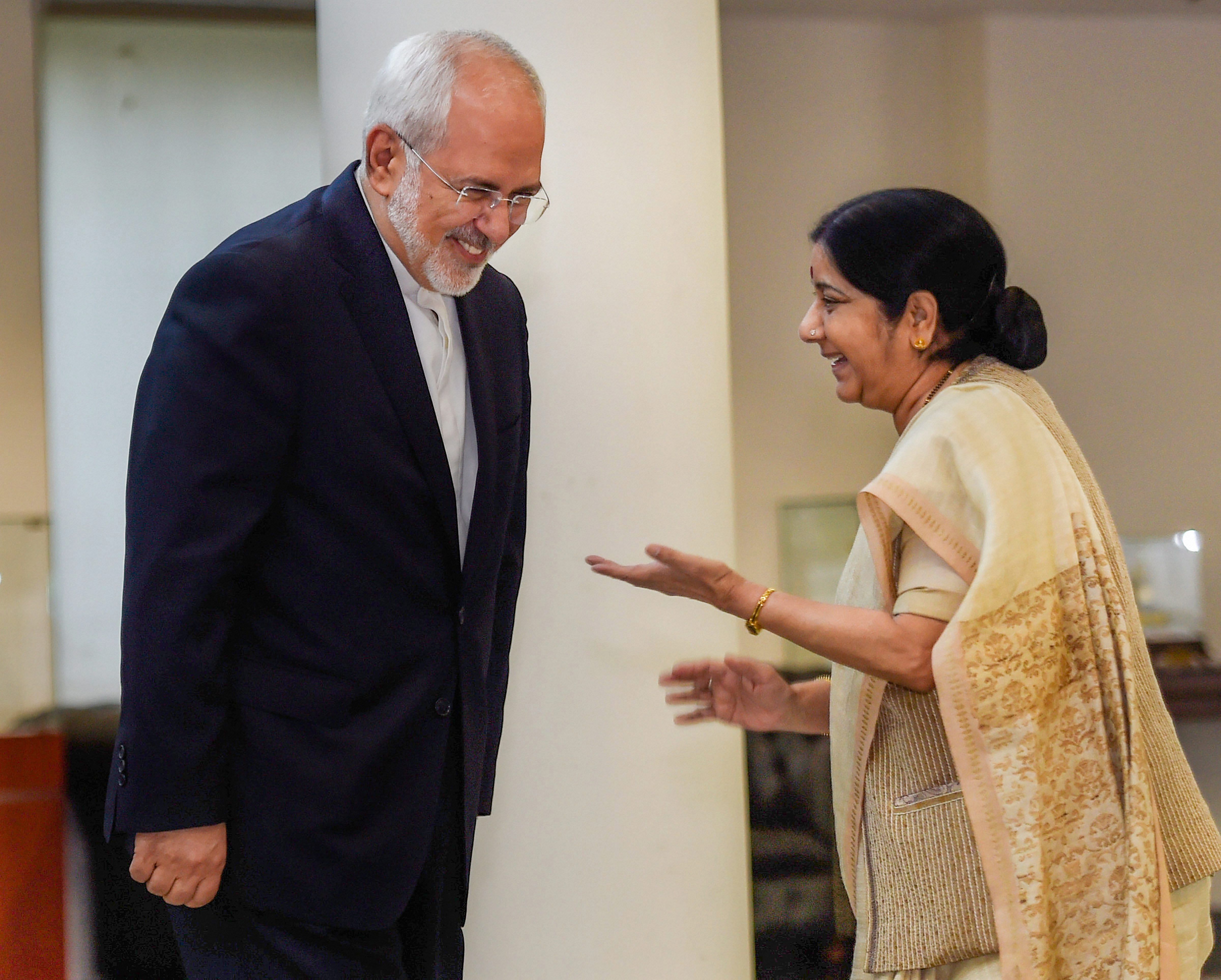 External Affairs Minister Sushma Swaraj greets her Iranian counterpart Mohammad Javad Zarif before a meeting, in New Delhi on Monday. PTI 