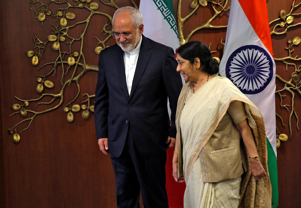 Iran's Foreign Minister Mohammad Javad Zarif and his Indian counterpart Sushma Swaraj walk after a photo opportunity in New Delhi, India, May 28, 2018.