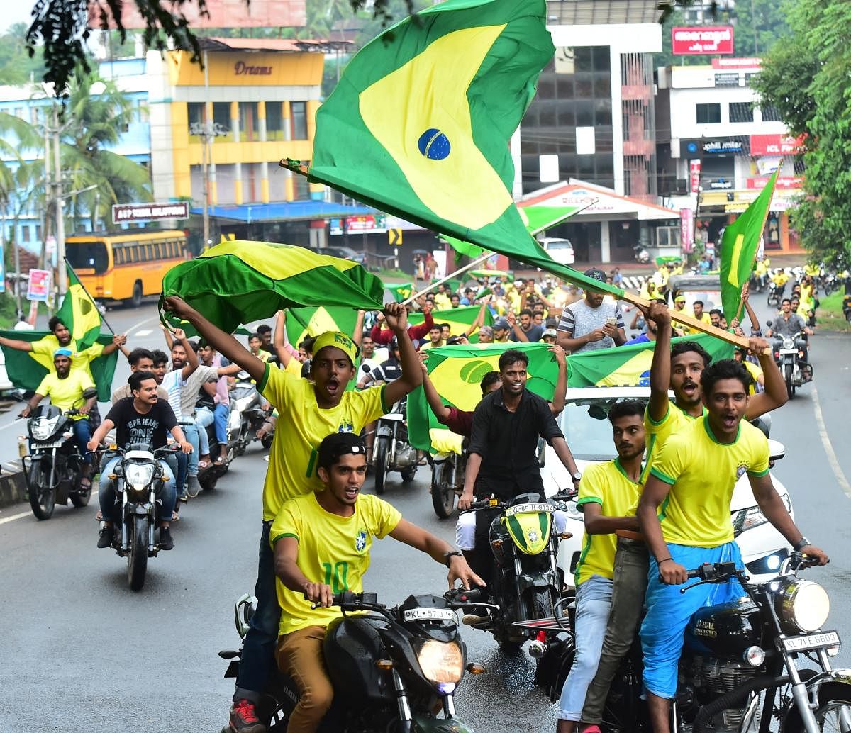 Brazil fans take out a bike rally in Malappuram. (DH Photo)