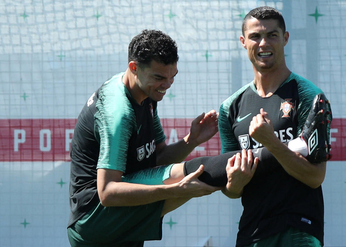 Portugal's Cristiano Ronaldo and Pepe during a training session. REUTERS