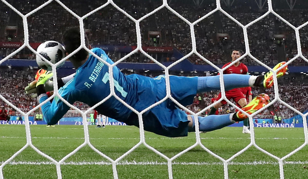 SAFE HANDS: Iran's custodian Alireza Beiranvand makes an excellent save off Portugal's Cristiano Ronaldo penalty during their Group B match in Saransk on Monday. Reuters