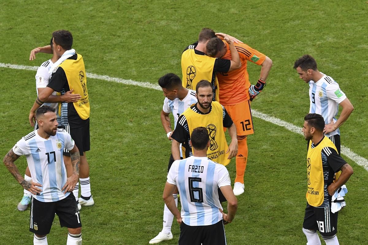 PAINFUL BLOW: Argentina players are a dejected lot after losing the last 16 game against France on Saturday. AFP