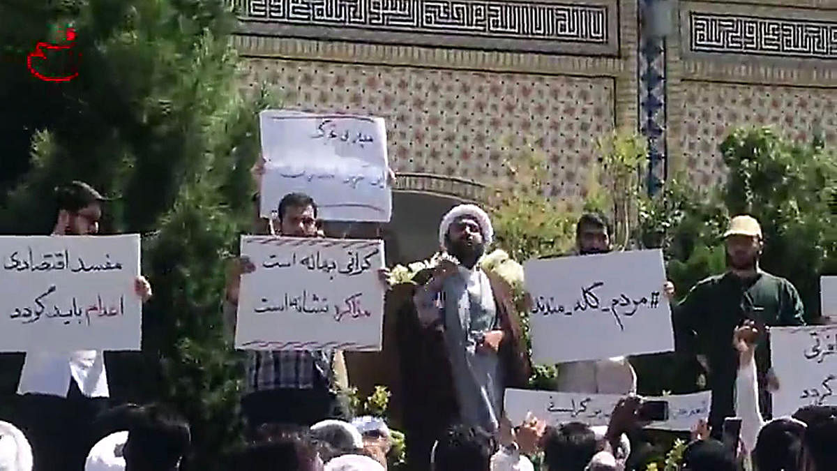 In this video grab made from a video by Nasim News Agency, a cleric speaks to a crowd of protesters demonstrating in Mashhad, in the Khorasan Razavi province, on August 3, 2018. AFP
