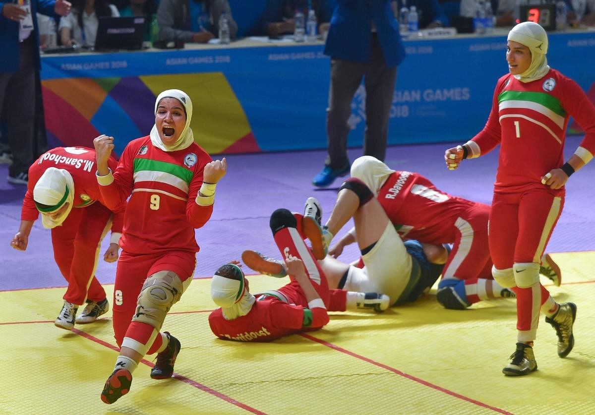 THE BIG MOMENT: Iranian players celebrate after defeating India in the women's kabaddi final in Jakarta on Friday. PTI