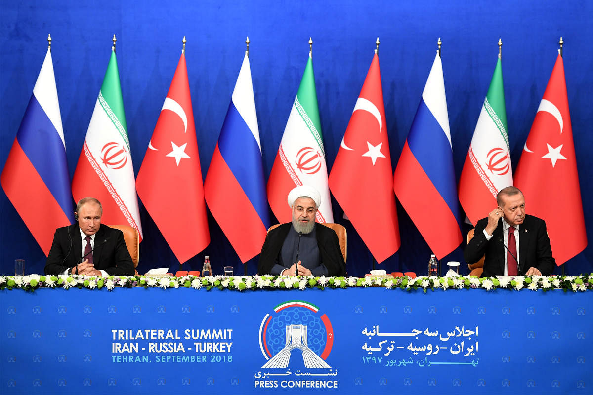 President Vladimir Putin of Russia, Hassan Rouhani of Iran and Tayyip Erdogan of Turkey attend a news conference following their meeting in Tehran, Iran, on September 7, 2018. Reuters