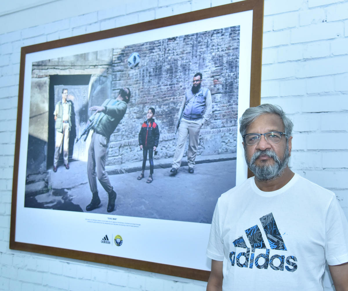 Artist Prashant Godbole says this photo is one of his favourites. It features a commando lost in playing football.