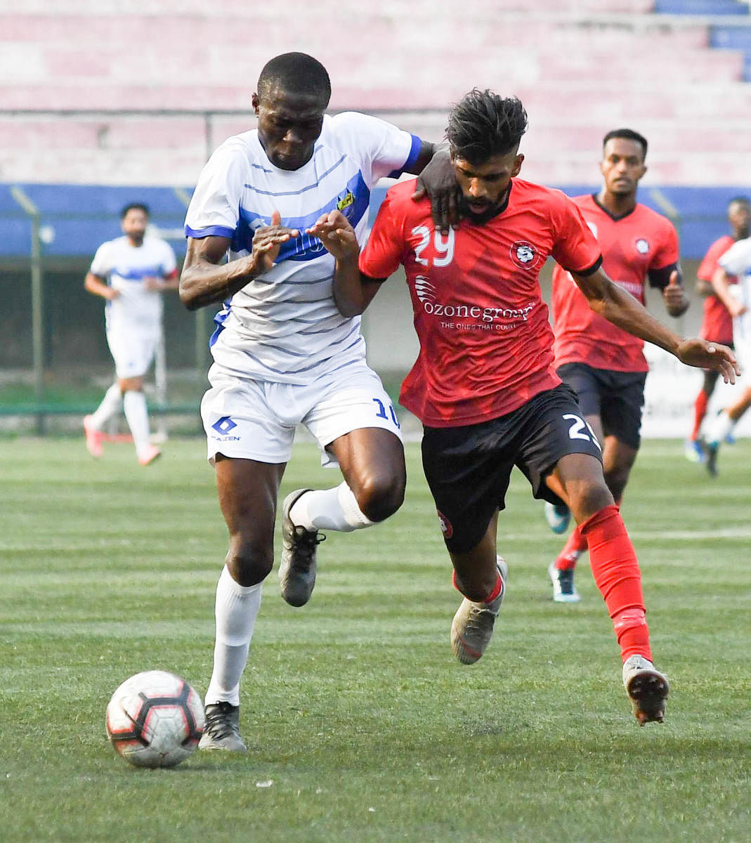 BIG GOALS: Hamza Abullahi (left) of Lonestar Kashmir in action against Ozone FC in the Second Division League. Hamza has played for many clubs in India and even has a home in Bengaluru. DH photo/ B H Shivakumar