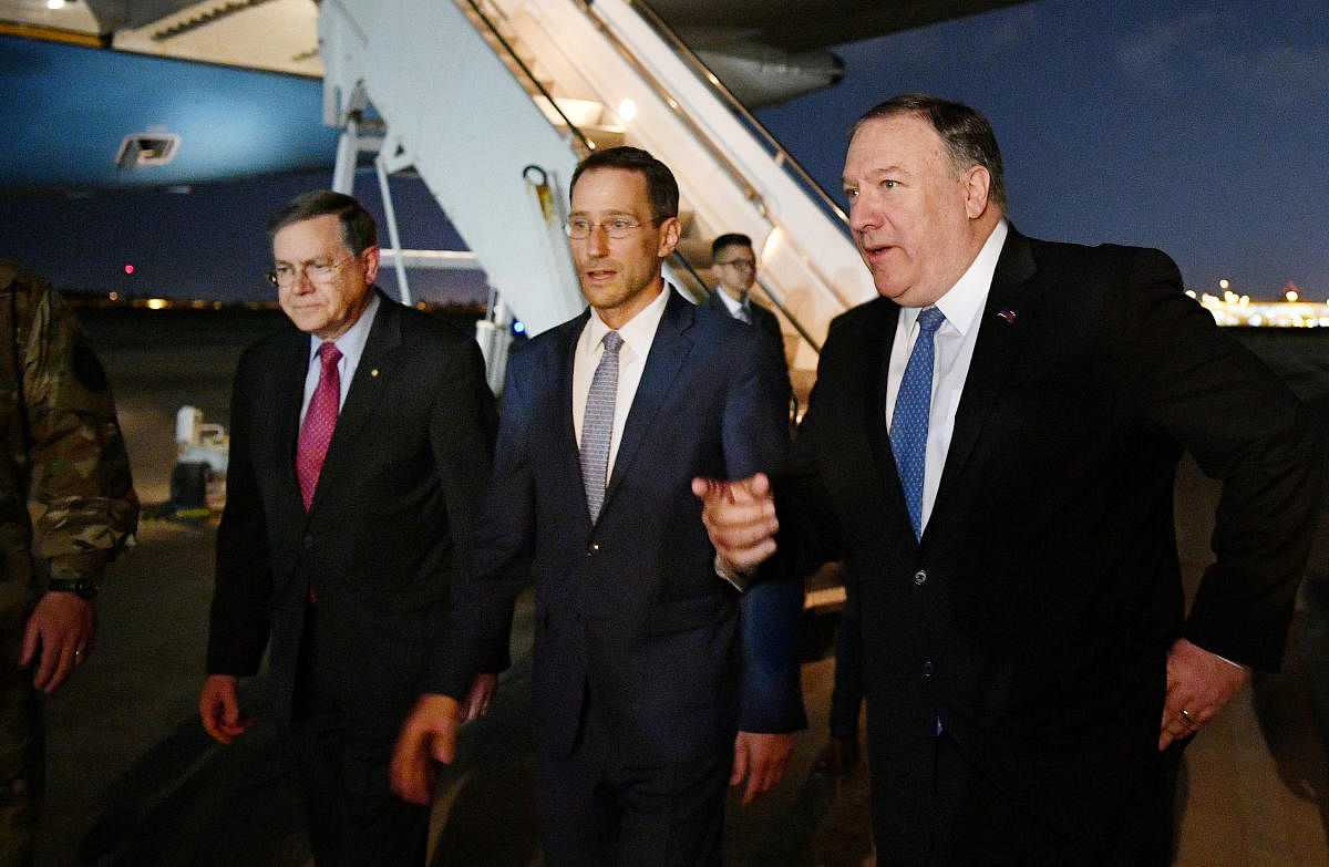 U.S. Secretary of State Mike Pompeo walks with Acting Assistant Secretary for Near Eastern Affairs at the State Department David Satterfield, and Charge D'affaires at the U.S. Embassy in Baghdad Joey Hood upon arrival in Baghdad, Iraq May 7, 2019. Mandel Ngan/Pool via REUTERS