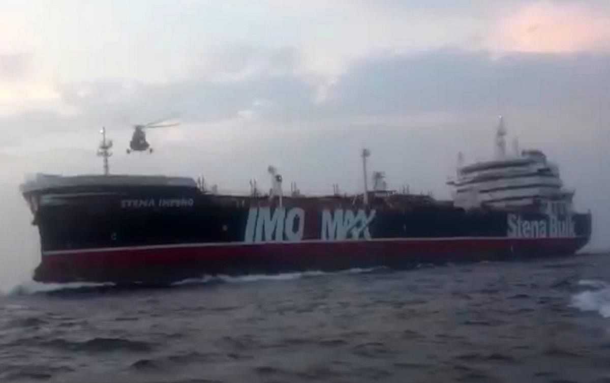 This image grab taken from a video provided by Iran's Revolutionary Guard official website via SEPAH allegedly shows Revolutionary Guard Corps boarding the British-flagged tanker Stena Impero in the Strait of Hormuz. Photo credit: AFP