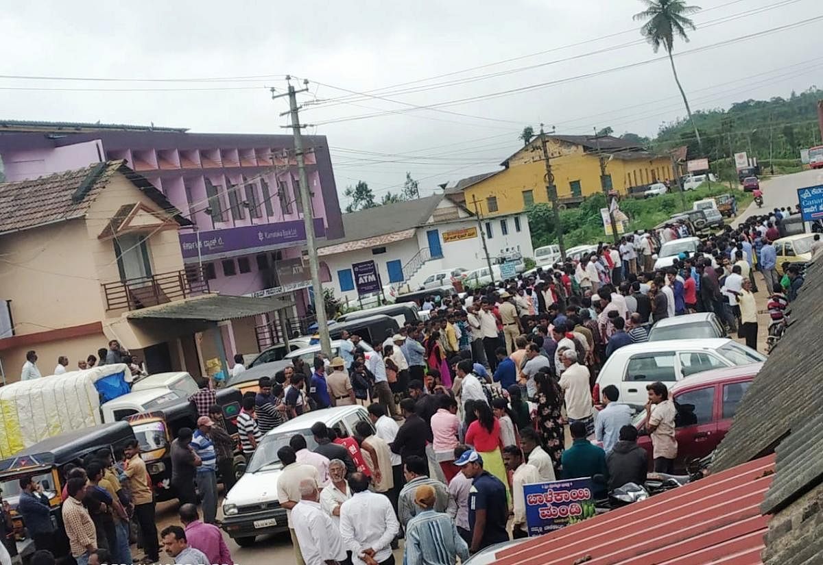 People wait on both sides of the road in Banakal to catch a glimpse of the mortal remains of Cafe Coffee Day founder V G Siddhartha Hegde.