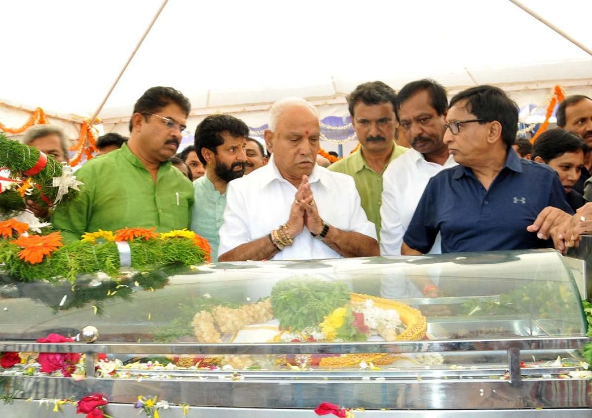 Chief Minister B S Yediyurappa pays homage to V G Siddharth Hegde.