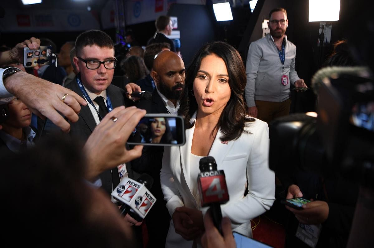 Tulsi Gabbard speaks to reporters in the spin room after the second round of the second Democratic primary debate of the 2020 presidential campaign season hosted by CNN (AFP Photo)