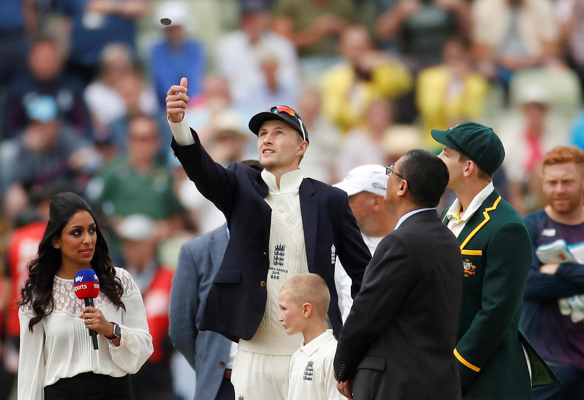 England's Joe Root flips the coin before the match Action (Photo by Reuters)