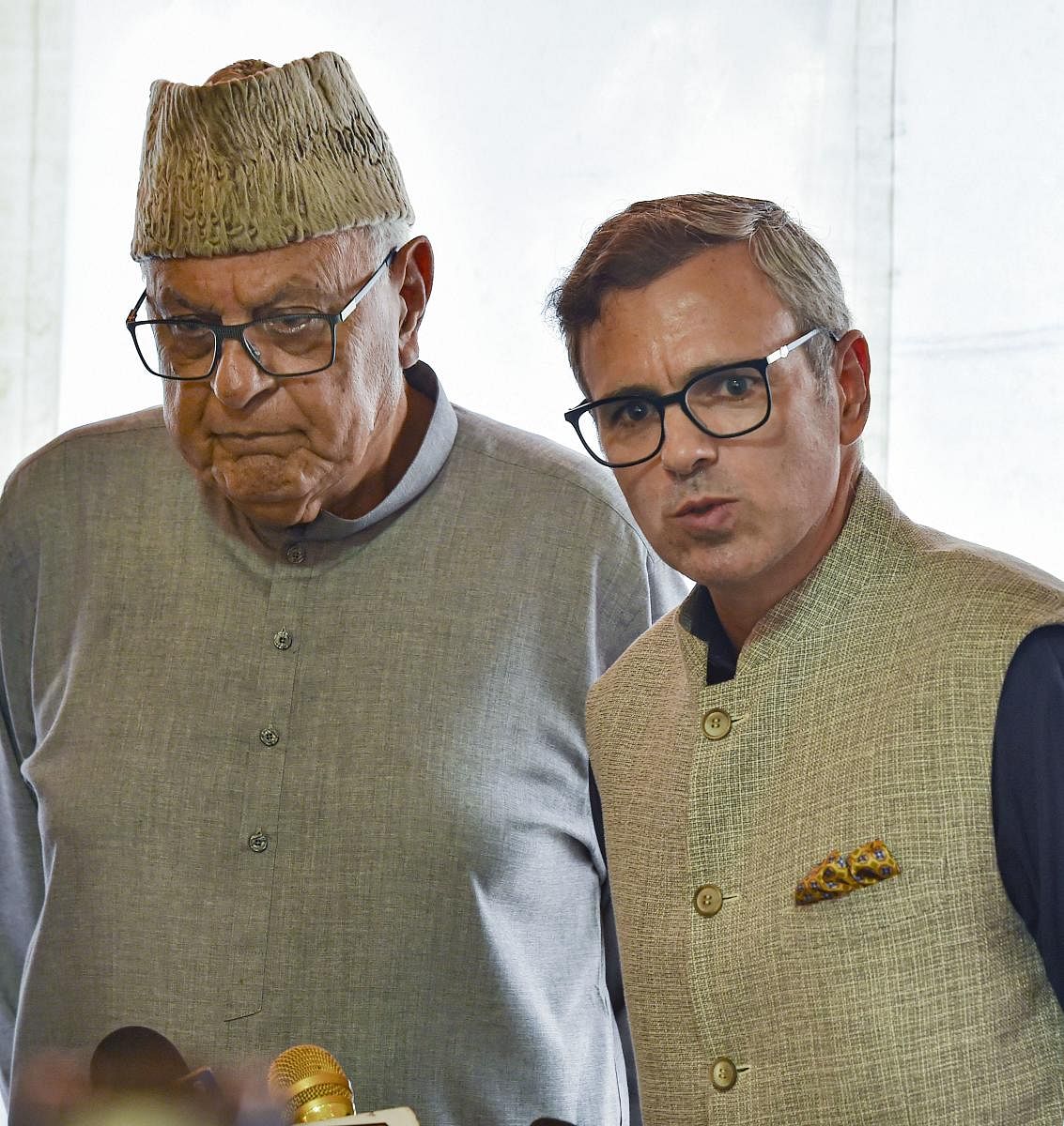 New Delhi: National Congress President Farooq Abdullah with party Vice-President Omar Abdullah address the media after their meeting with Prime Minister Narendra Modi, at the Parliament in New Delhi, Thursday, Aug 1, 2019. (PTI Photo)