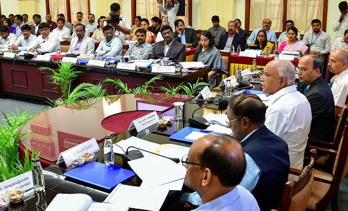 Chief Minister B S Yediyurappa at a meeting with regional commissioners, deputy commissioners and chief executive officers of Zilla Panchayats, in Vidhana Soudha on Bengaluru. DH Photo