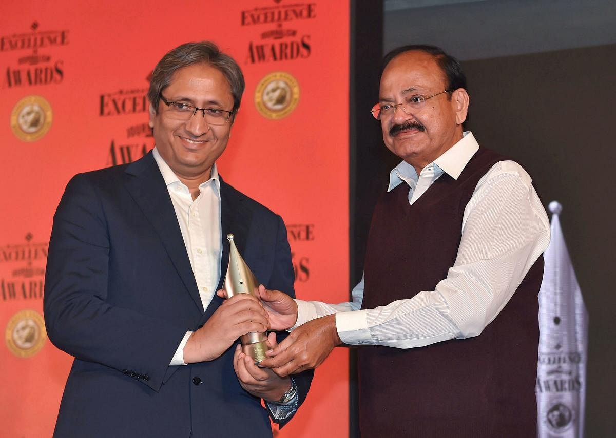 **FILE** New Delhi: In this file photo dated Dec 20, 2017, is Vice President M Venkaiah Naidu presenting an award to Ravish Kumar, NDTV India at The 12th edition of Ramnath Goenka Excellence in Journalism Awards, in New Delhi. Kumar on Friday, Aug 2, 2019
