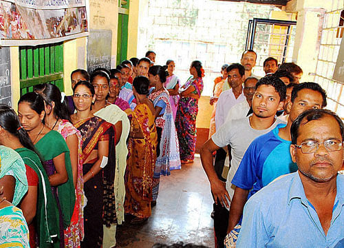 People wait to cast their votes for Lok Sabha elections at Chimbel in Panaji on Saturday. Goa registered 76.82% record voting. PTI Photo