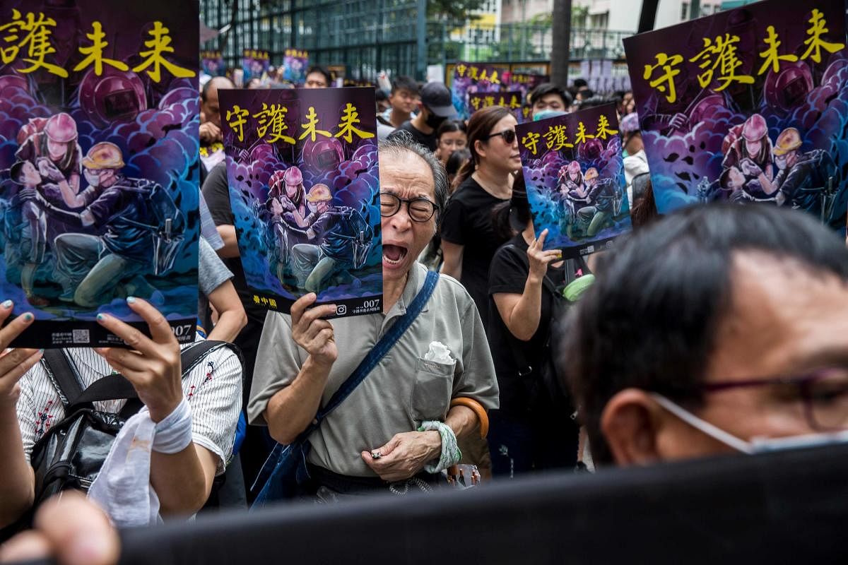 People attend a protest in the Mong Kok district of Hong Kong. Anti-government protesters in Hong Kong kicked off a new mass rally as they defy increasingly stern warnings from China over weeks-long unrest that has plunged the city into crisis. AFP photo