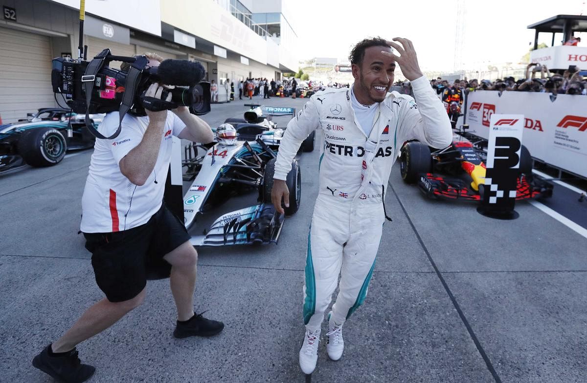 Formula One F1 - Japanese Grand Prix - Suzuka Circuit, Suzuka, Japan - October 7, 2018 Mercedes' Lewis Hamilton celebrates winning the race REUTERS