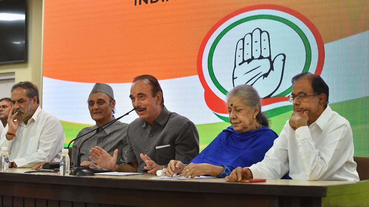 Senior Congress leader Ghulam Nabi Azad addresses the media as party leaders (L-R) Anand Sharma, Karan Singh, Ambika Soni and P Chidambaram look on, in New Delhi (PTI Photo)
