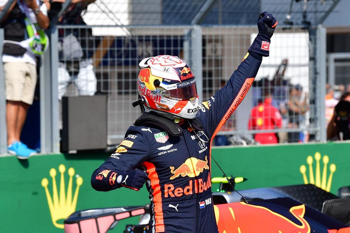 Max Verstappen celebrates after he took his maiden pole position in Formula One (AFP Photo)
