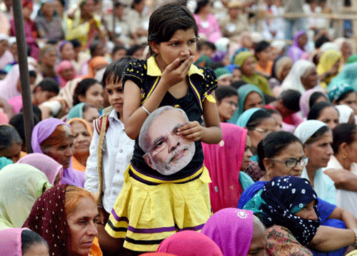 workers at Prime Minister Narendra Modi's election campaign rally in Sirsa, Haryana on Saturday. PTI Photo
