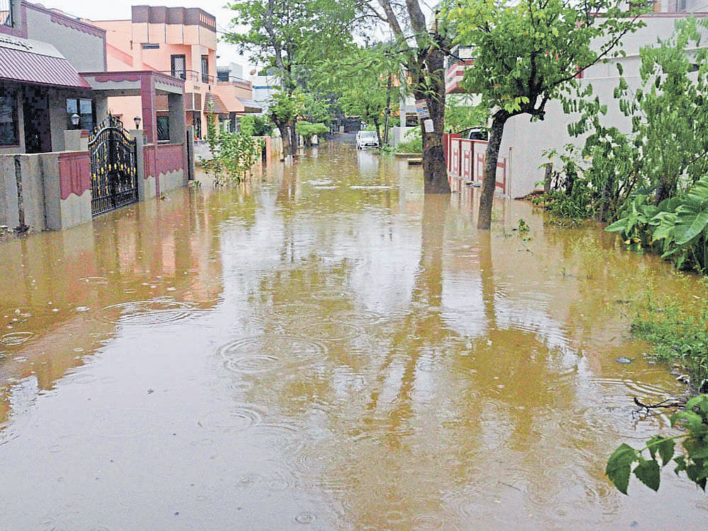 A waterlogged street at CB Nagar in Dharwad on Sunday. DH photo