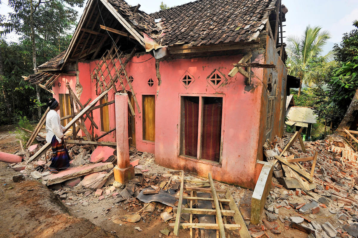 A man examines his house damaged after an earthquake hit in Pandeglang, Banten province, Indonesia. (Reuters Photo)