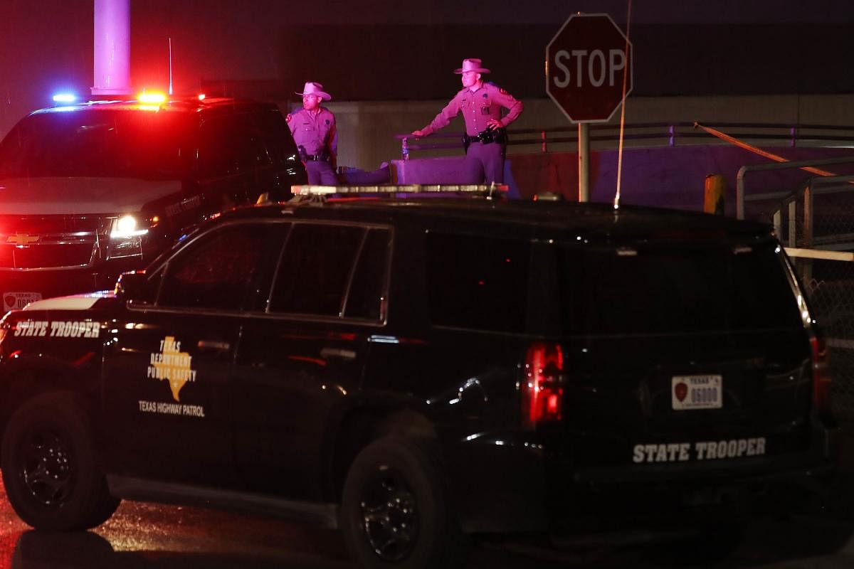 Police keep watch outside Walmart, El Paso where the first shooting of the day took place (Getty Images/AFP)