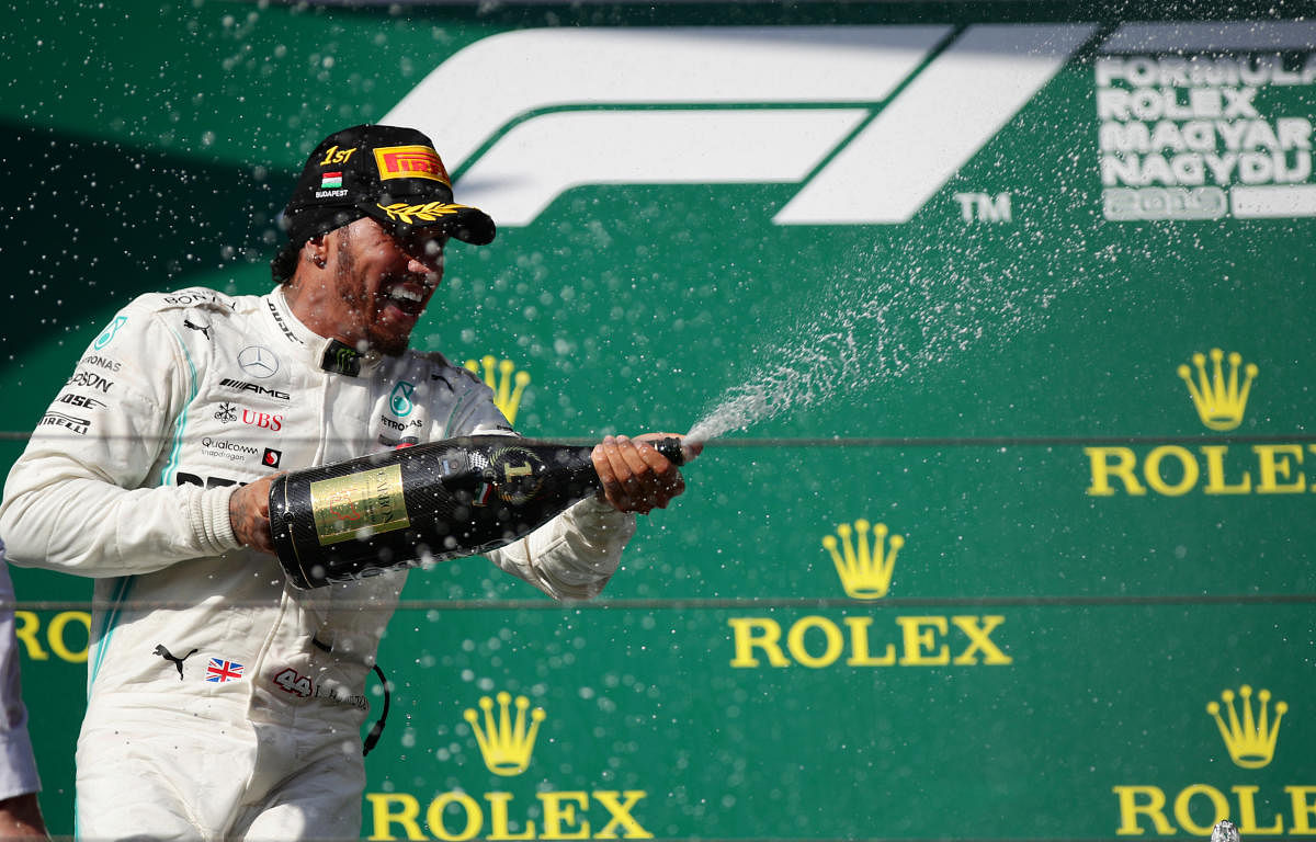 Mercedes' Lewis Hamilton celebrates winning the Hungarian Grand Prix with champagne (Reuters Photo)