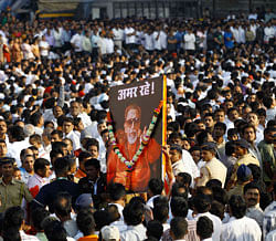 Mourners carry a poster of Hindu hardline Shiv Sena party leader Bal Thackeray with the words 'Long Live' during his funeral in Mumbai, India. File AP Photo
