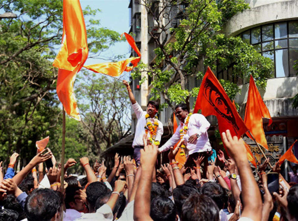 Shiv Sena workers celebrate their victory in Muncipal Corporation elections in Thane, Mumbai on Thursday. PTI Photo