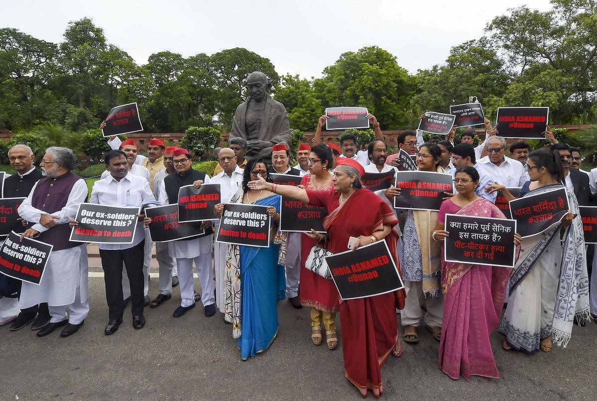 Samajwadi Party member Jaya Bachchan and other MP's from various opposition parties stage a protest over the accident of Unnao rape survivor at Parliament House during the Budget Session, in New Delhi. (PTI Photo)
