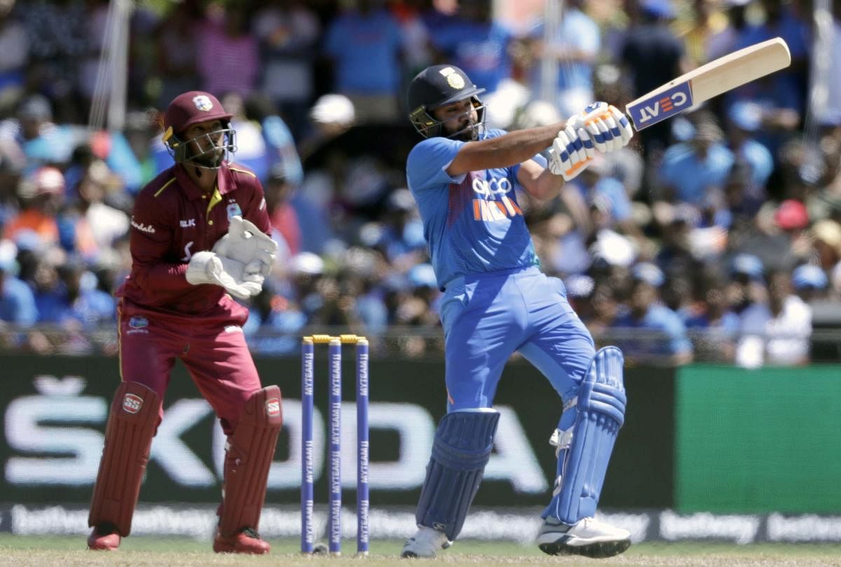 Rohit Sharma hits a six during the second Twenty20 international cricket match against the West Indies (PTI Photo)
