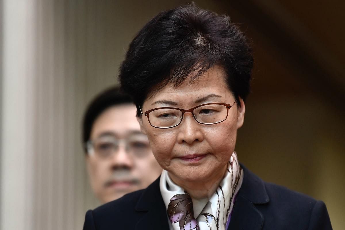 With commuters unable to get to work and international travellers facing delays, chief executive Carrie Lam held a press conference to warn protesters and signal authorities would not buckle under the growing pressure. (AFP)
