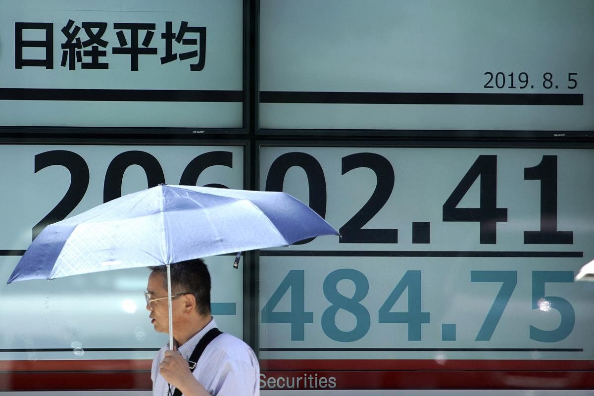 The currency weakened to 7.0391 to the dollar by late afternoon, making one yuan worth 14.2 cents, its lowest level since February 2008. (AP/PTI Photo)