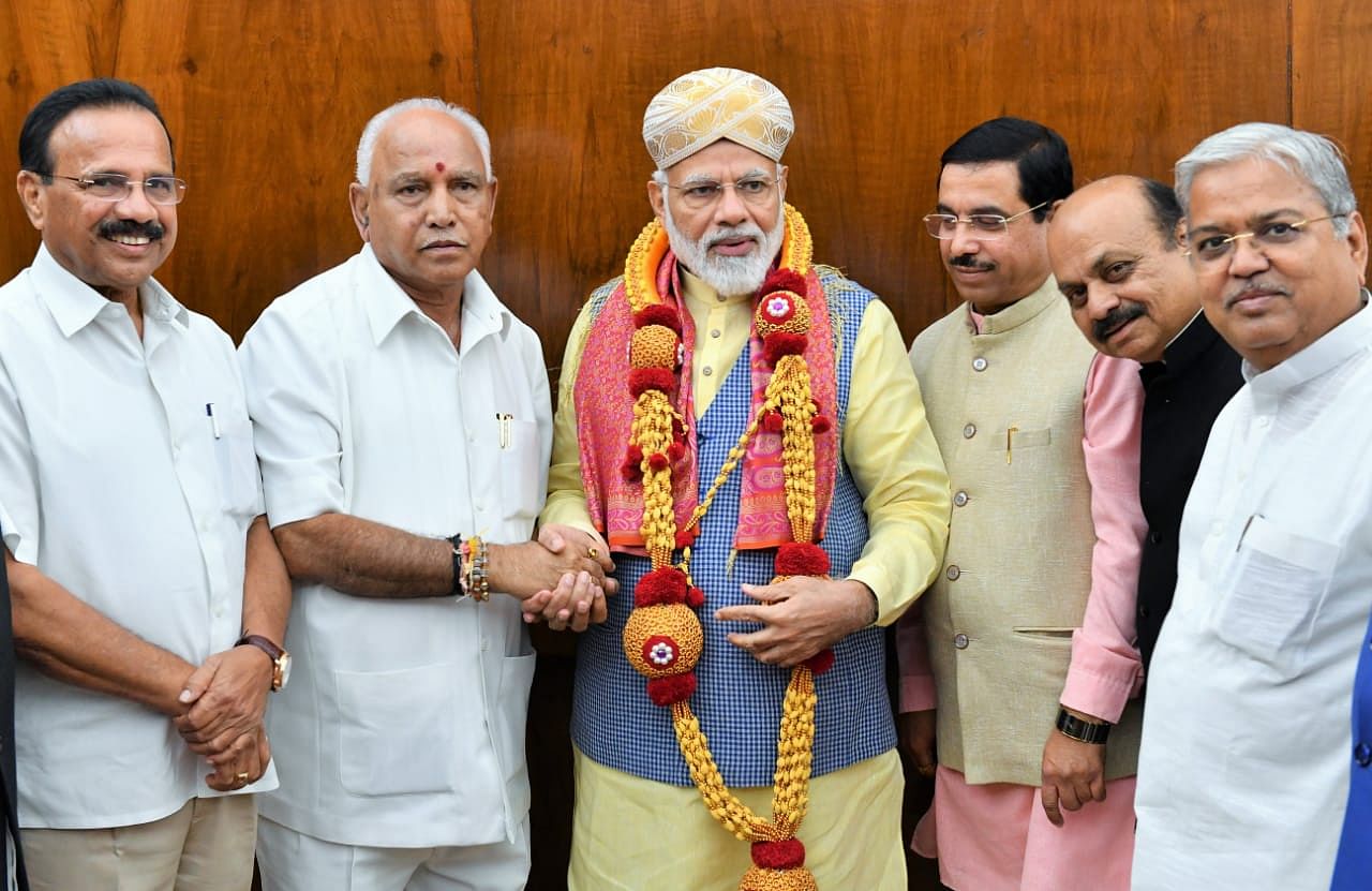 Chief Minister B S Yediyurappa meets Prime Minister Narendra Modi at New Delhi on Tuesday. DH photo