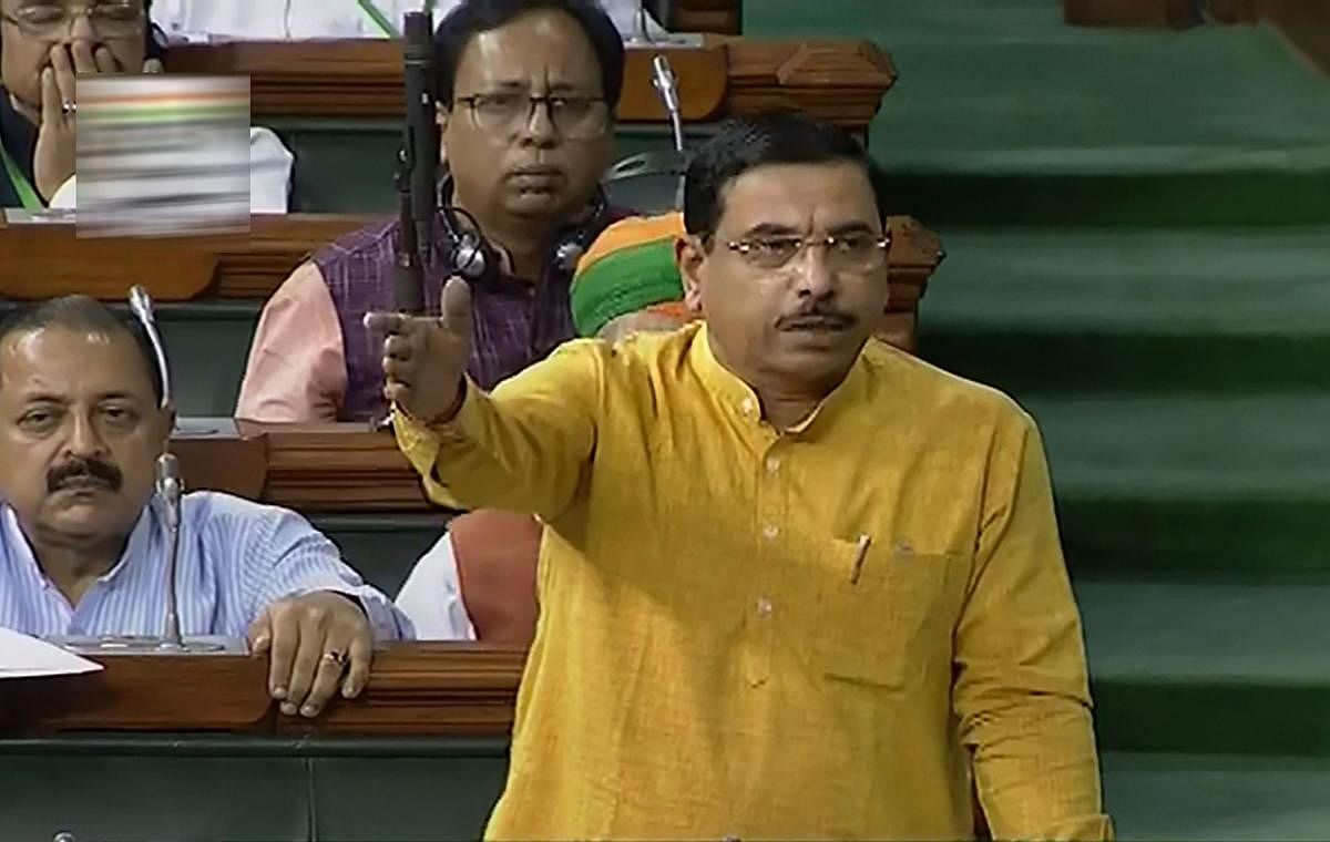 Minister of Parliamentary Affairs Pralhad Joshi speaks in the Lok Sabha during the Budget Session of Parliament, in New Delhi. (PTI Photo)