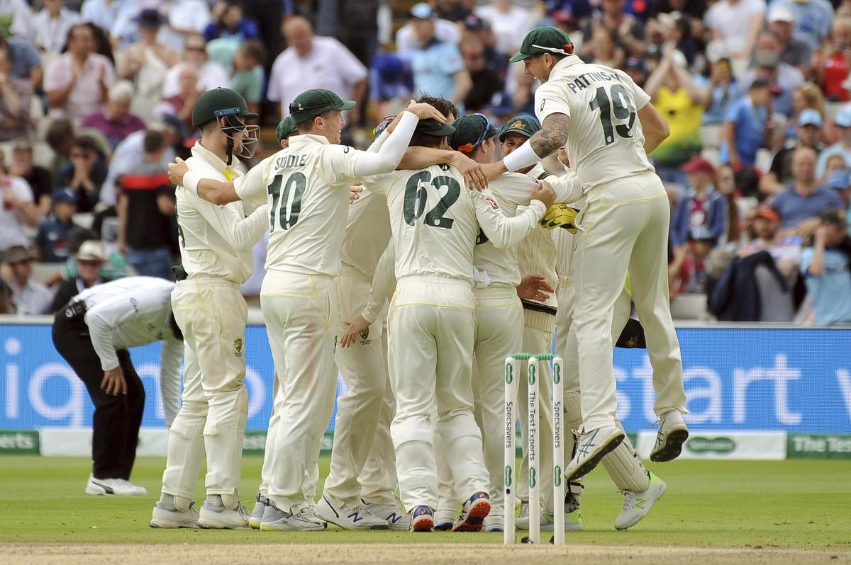 Australia players celebrate after beating England by 251 runs during day five of the first Ashes Test cricket match between England and Australia at Edgbaston. Photo credit: PTI