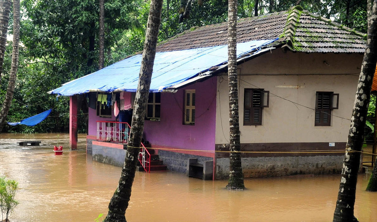 An inundated house in Udupi. DH file photo