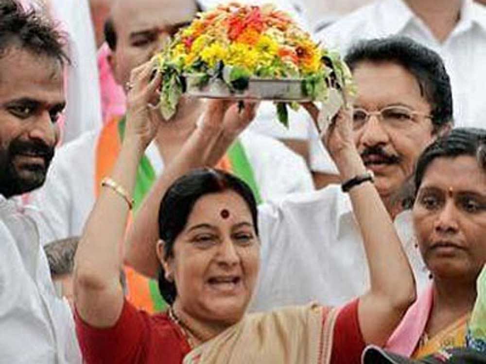 Sushma Swaraj with traditional Bonalu (offering to Goddess) of Telangana. DH file photo