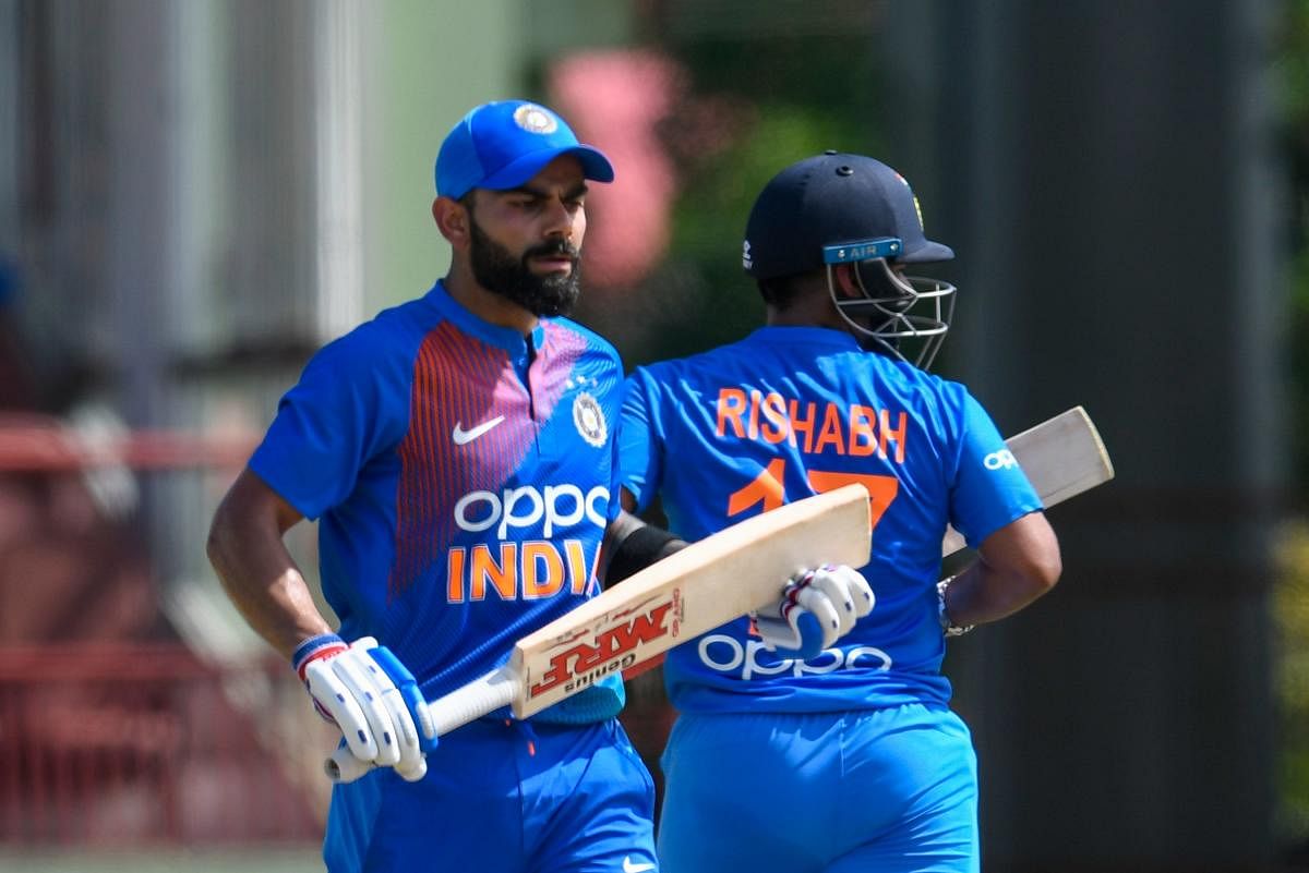 Virat Kohli (L) and Rishabh Pant (R) of India 100 partnership during the 3rd T20i match between West Indies and India at Guyana National Stadium in Providence, Guyana, on August 6, 2019. (AFP)