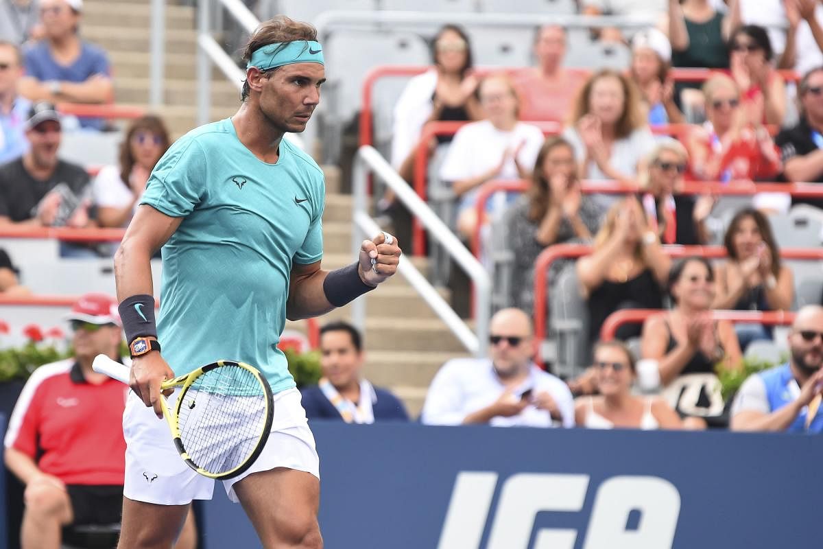 Rafael Nadal of Spain celebrates a point against Daniel Evans of Great Britain during day 6 of the Rogers Cup at IGA Stadium on August 7, 2019 in Montreal, Quebec, Canada. (AFP Photo/Minas Panagiotakis)