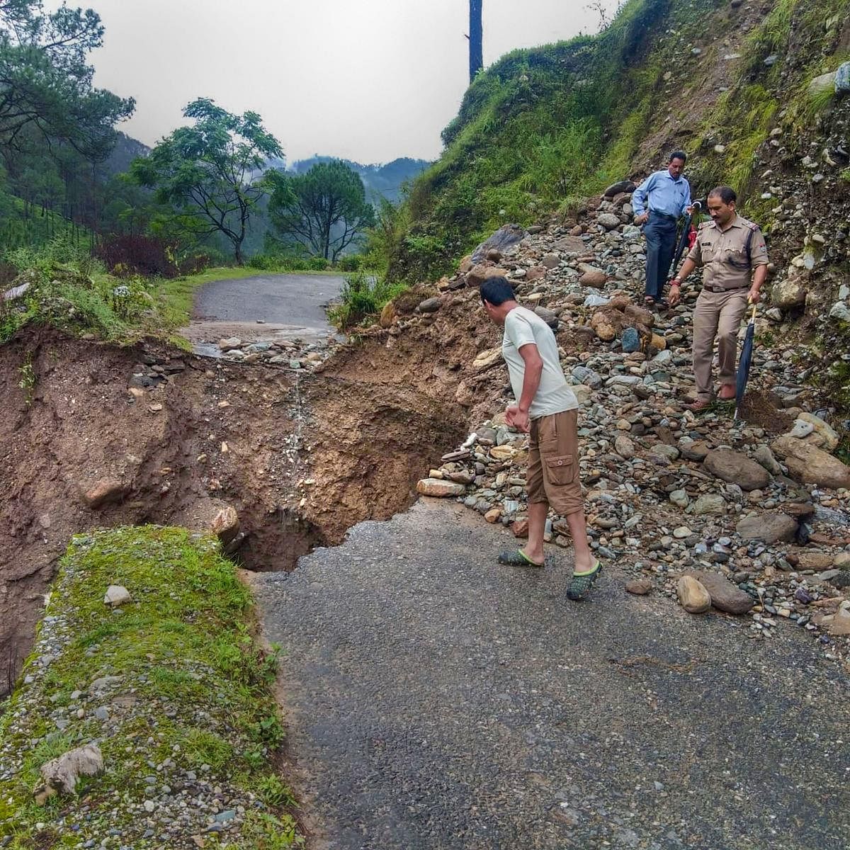 A portion of a road caved due to heavy rain following a cloudburst, in Chamoli district, Friday, Aug 9, 2019. (PTI Photo)