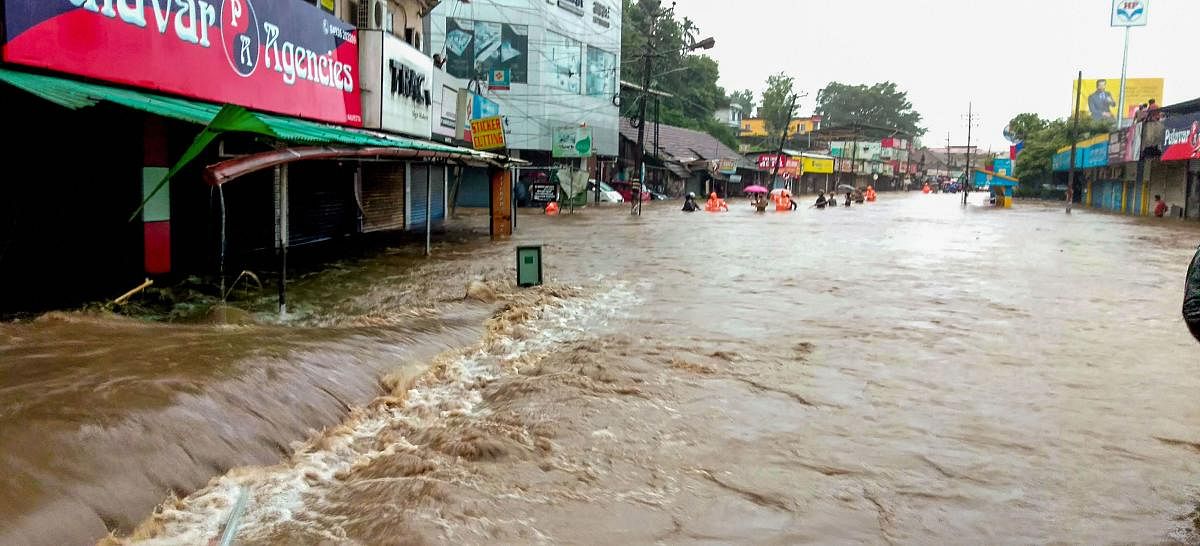 A flooded street following incessant monsoon rainfall, at Kalpetta in Wayanad on Friday. PTI photo