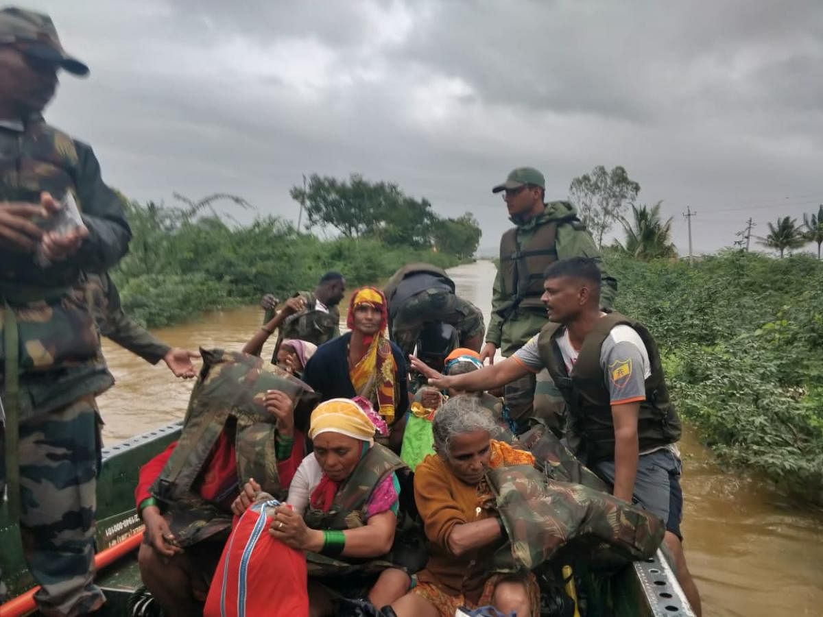 Army troops help rescue civilians in Belgaum District on August 8, 2019.