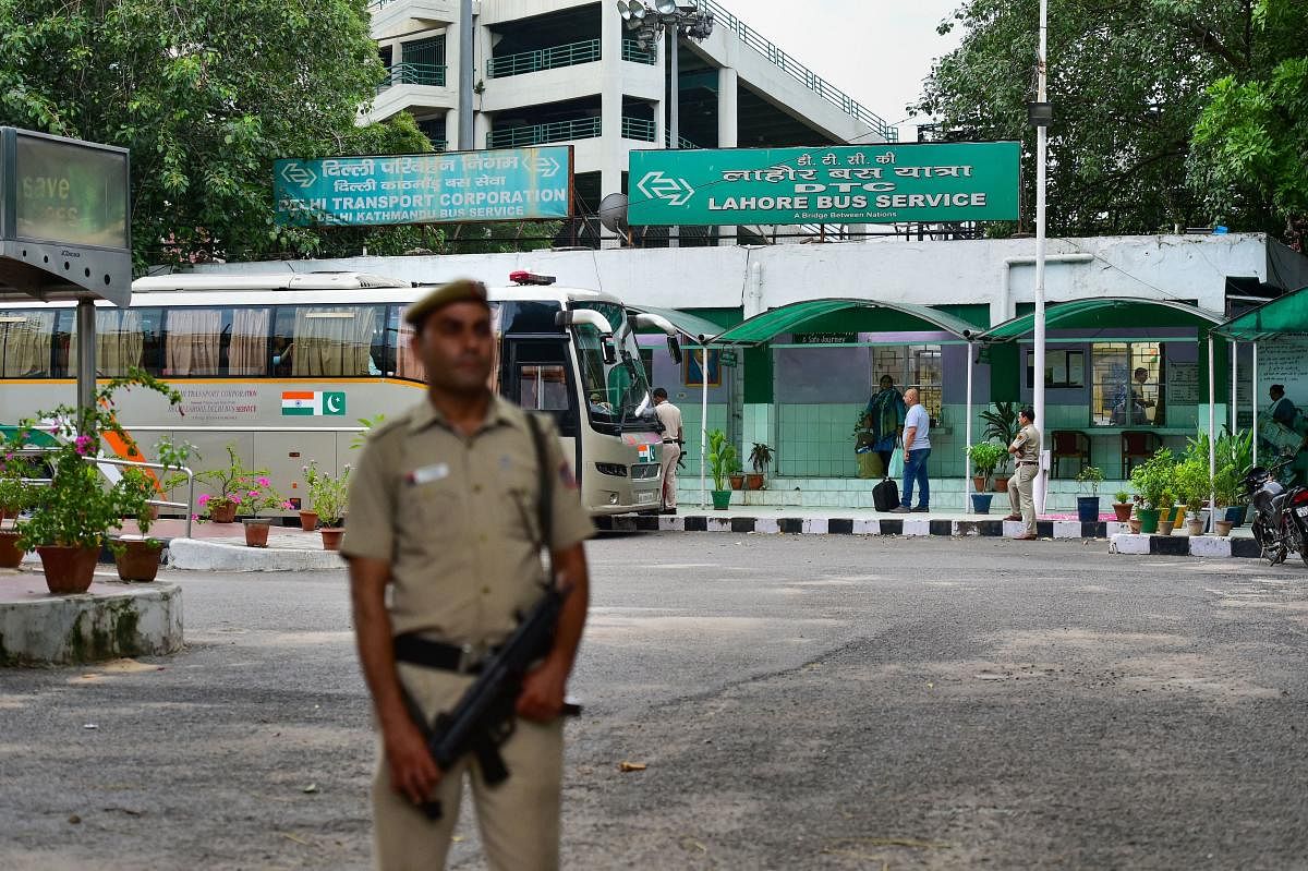 A security personnel stands guard as passengers board the Delhi-Lahore bus, also known as Sada-e-Sarhad, at Ambedkar terminal in New Delhi, Friday, Aug 9, 2019. (PTI File Photo)