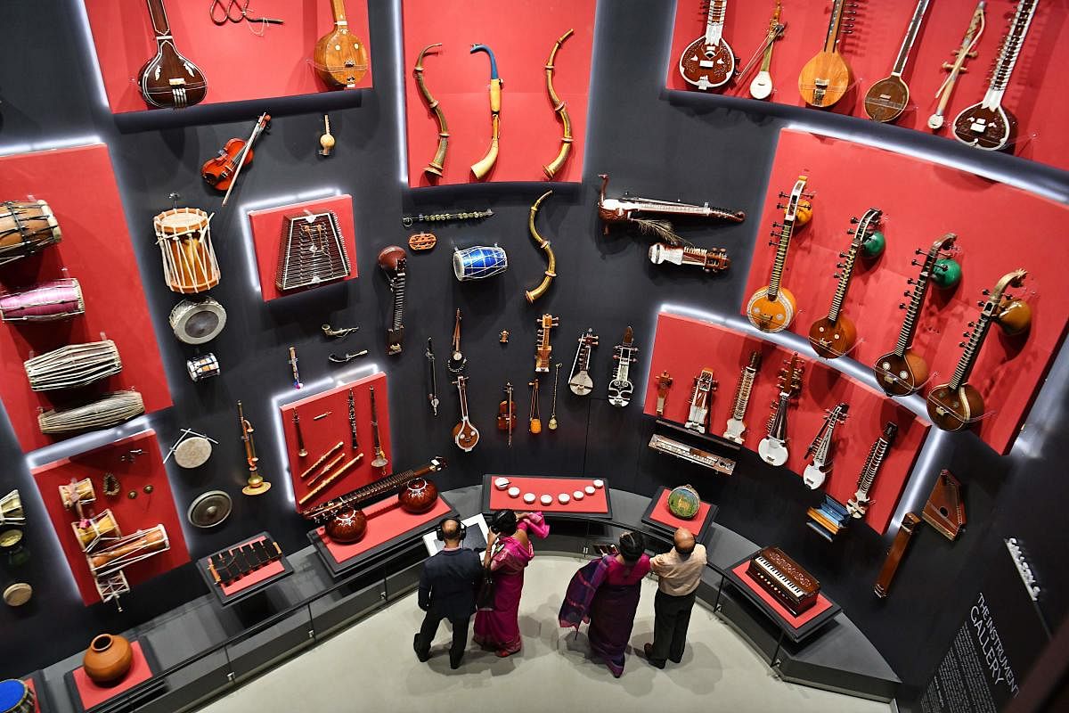 Visitors look at various musical instruments from all over the world at the Indian Music Experience (IME), India’s first interactive music museum, in Bengaluru. AFP